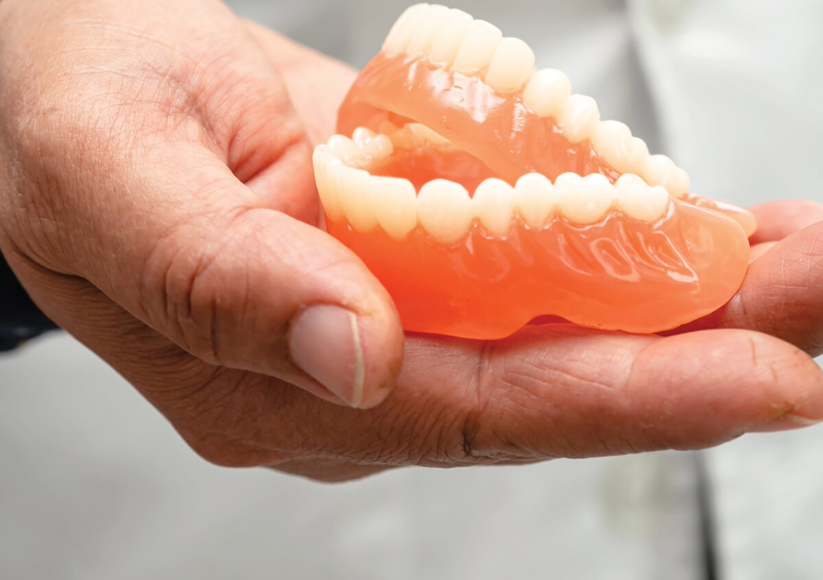 How do I take care of my full dentures?