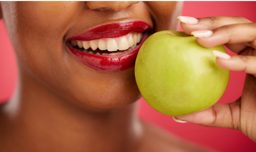 A patient showing her teeth after whitening at Rugby Dental Arts in Charlottesville