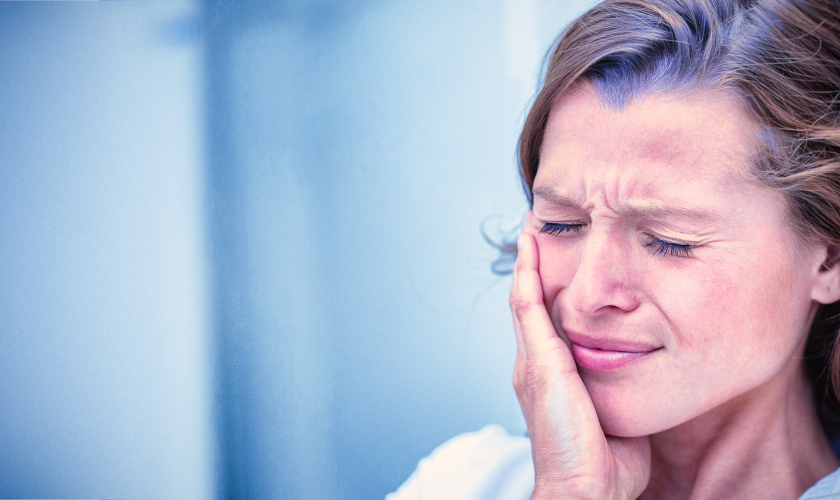 Patient experiencing dental pain during a festival in Charlottesville VA seeking emergency dental care
